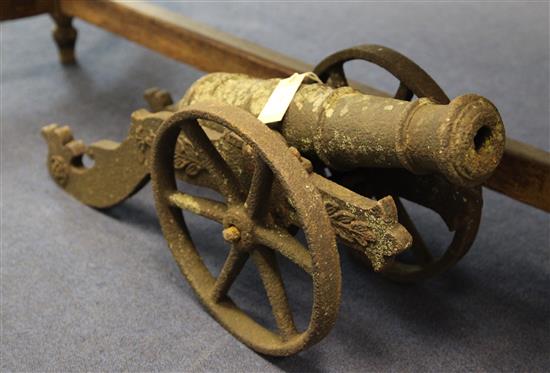 Late 19th / early 20th century cast iron cannon, 18.5in. (length of barrel), overall 26.5in.